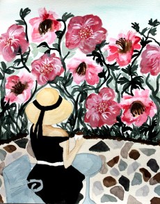 Woman sitting on patio looking at flowers